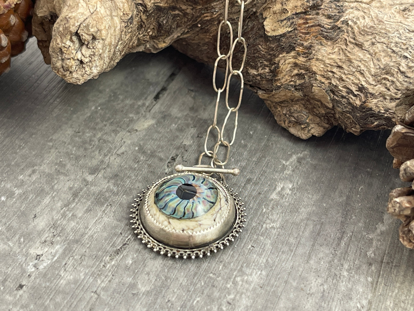 "The Memory Keeper"- Blue glass eye pendant