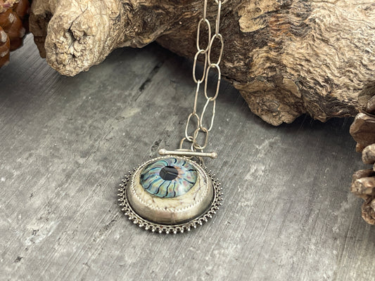 Blue glass eye pendant